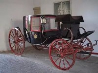 the family Carriage with the hand painted Family Crest 
